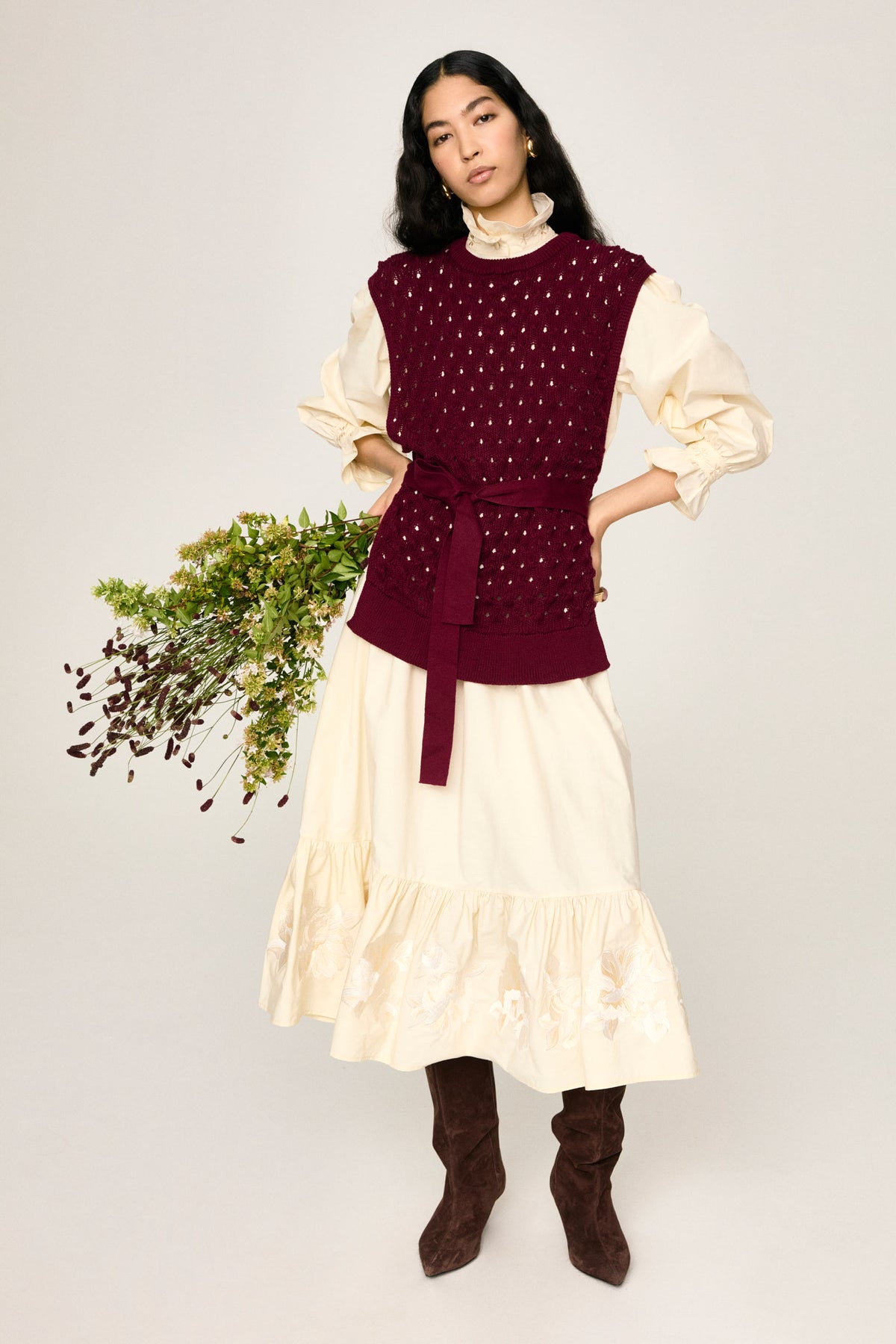 Amparo burgundy openwork knit vest by Ika Jane, tied at the waist